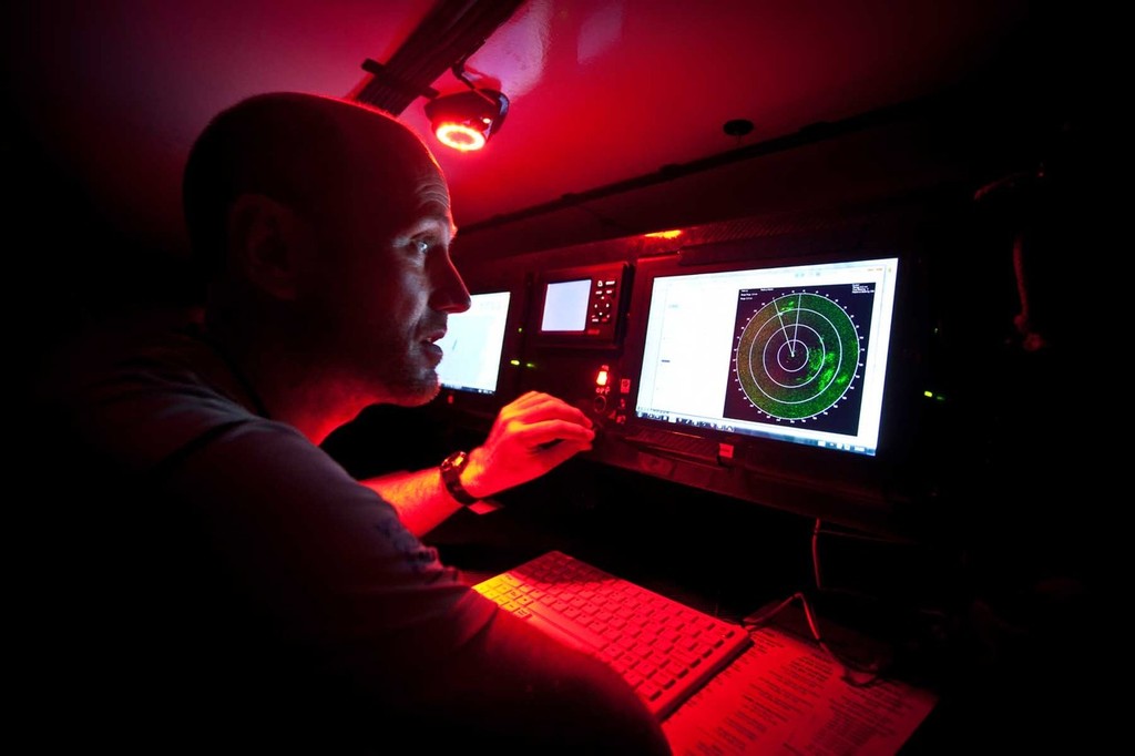 Navigator Tom Addis eyes the radar screen from the navigation station. PUMA Ocean Racing powered by BERG during leg 2 of the Volvo Ocean Race 2011-12 © Amory Ross/Puma Ocean Racing/Volvo Ocean Race http://www.puma.com/sailing